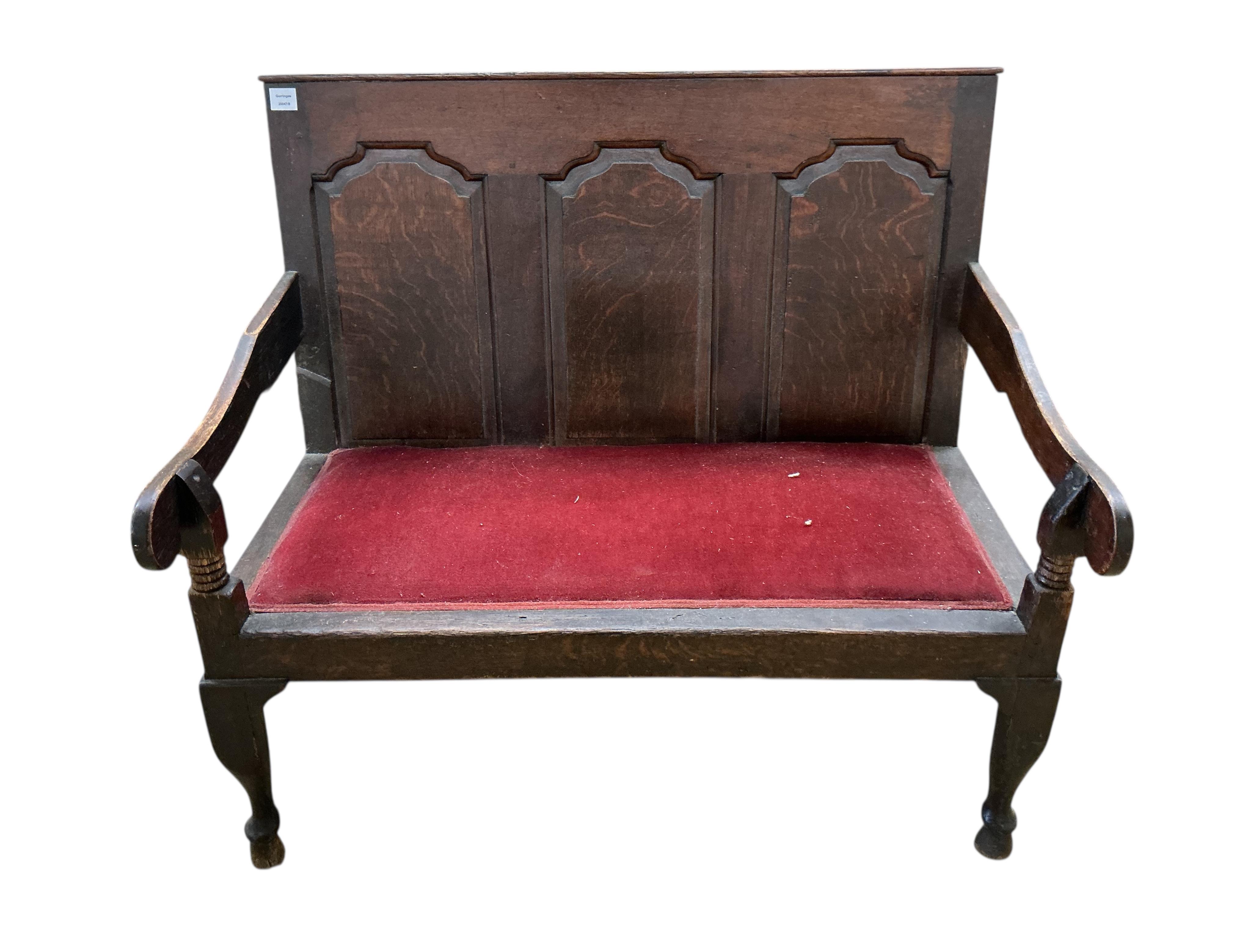A small George III panelled oak settle, width 112cm, depth 65cm, height 99cm